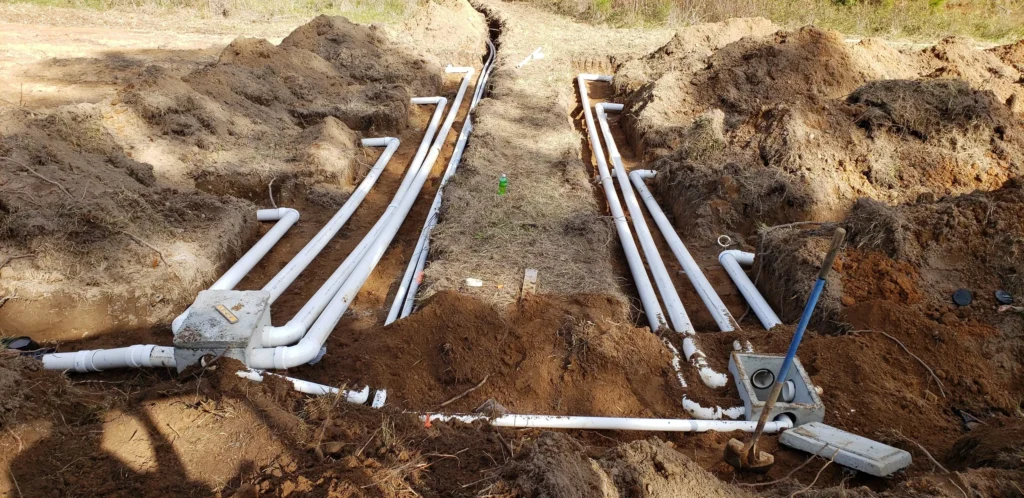 Header and lateral pipework laid out in an open trench, Carolina Septic, CSRA